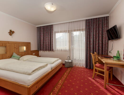 Gemütliches Familienzimmer im 4 Sterne Hotel Moser in Rohrmoos Schladming