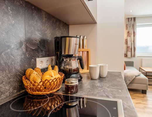 Coffee machine in the kitchen in apartment B